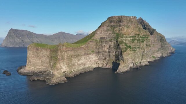 Drone shot of vertical cliffs of Kalsoy on Faroe Islands