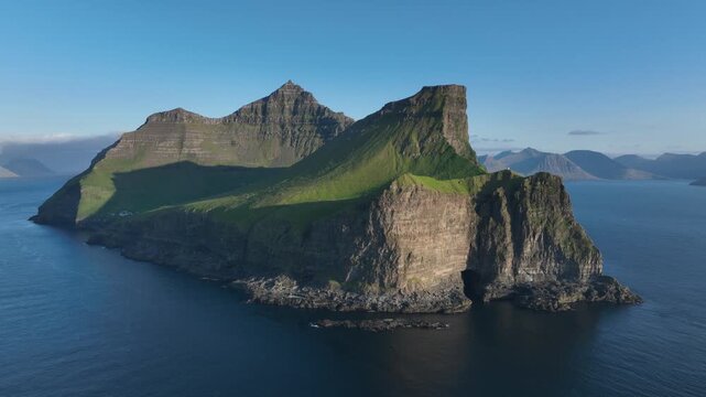 Drone shot of vertical cliffs of Kalsoy on Faroe Islands