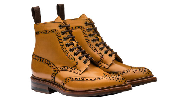 Tan leather brogue boots with dark brown laces, isolated on transparent background