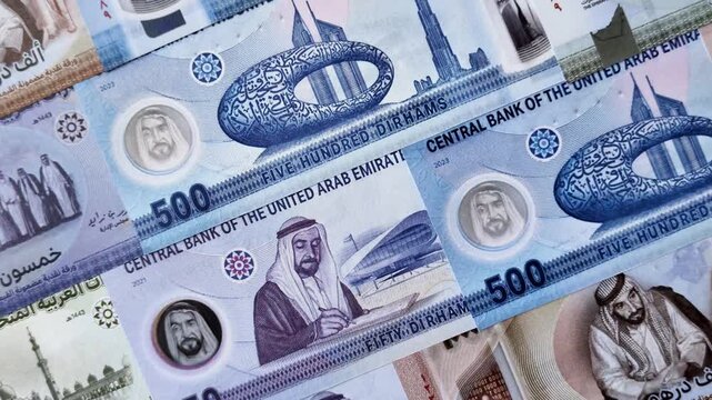 United Arab Emirates cash, paper dirhams, and coins for exchange and financial transactions. UAE currency as a background for your design