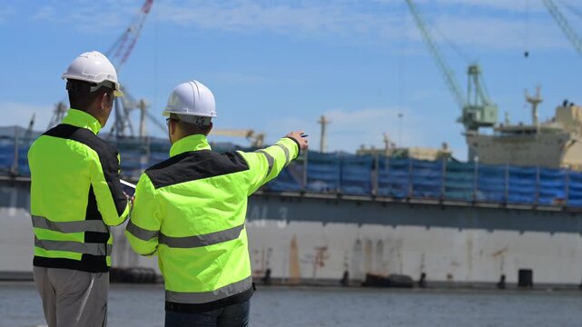 An engineer works at a busy shipping port, inspecting containers and managing logistics operations, ensuring smooth import and export processes with safety and efficiency in global trade.