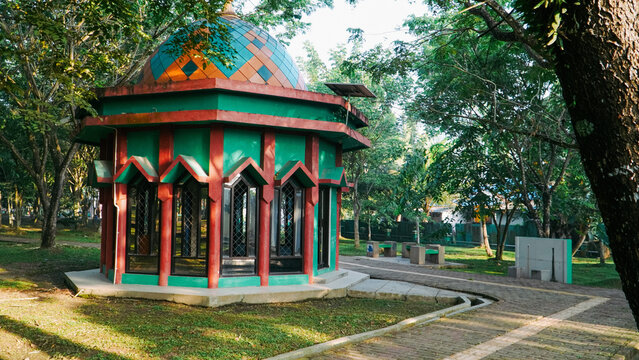 Beautiful garden pavilion with islamic architectural style and colorful dome.