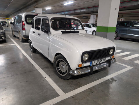 Palma de Mallorca, Spain &ndash; April 07, 2026: Classic white Renault 4L Limousine, Spanish version, parked in supermarket underground parking garage. Nostalgic vintage french brand vehicle from 1960s. 