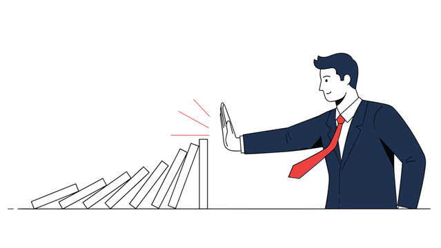 Determined businessman in a suit uses his hand to stop a row of falling dominoes representing crisis management and control.