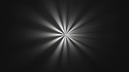 Fototapeta premium Rays of Light Emanating from a Central Point on a Black and White Background with a Soft Gradient Effect