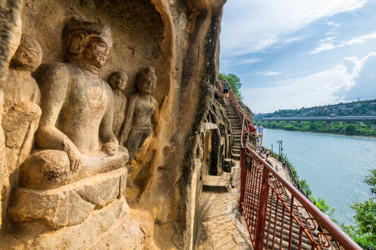 Ancient Buddhist Statues at Qianfoya Cliff with High Speed Train in Guangyuan, Sichuan, China