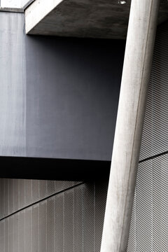 Wall shadow and vertical texture around a concrete column as abstract architecture in modern minimal style with reduced geometry and calm space