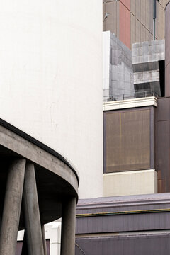 Arcade columns and curve with facade contrast shown as abstract architecture in modern minimal style emphasizing geometry and spatial depth