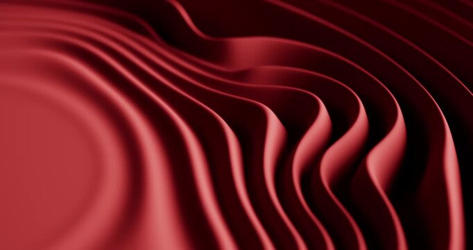 Abstract red flowing waves create a smooth futuristic three dimensional background.