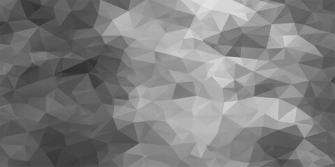 Obraz premium A geometric gray background image, composed of numerous triangular and polygonal shapes, creating an abstract and modern visual representation. 
