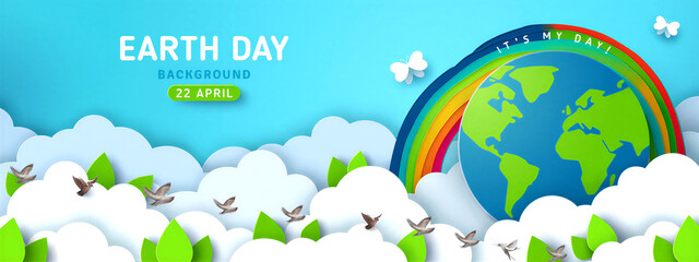 Naklejka premium Colorful earth day celebration background with globe rainbow and flying birds in nature scene