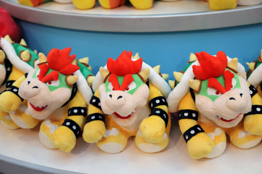 Plush toys of Bowser, the Koopa King character from Super Mario Bros in a store