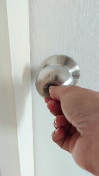 Slow motion emergency bathroom door unlock using coin, simple hack to open privacy lock from outside safely and quickly, 4K video record by smartphone.
