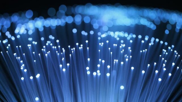 Glowing fiber optic strands creating abstract light patterns in this beautiful digital motion background animation video clip