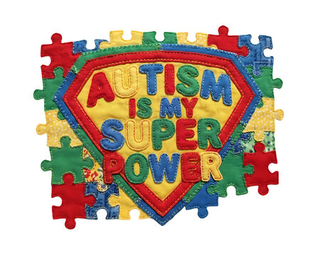 ​A vibrant fabric patch showing that autism is a superpower with colorful stitched puzzle pieces on transparent