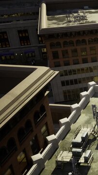 Rooftops of buildings are visible at night with city lights glowing from the windows. Some air conditioning units are placed along the edges of the rooftops.