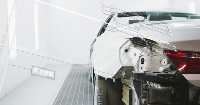 Showing white sedan rear-right quarter exposing panel and removed bumper in paint booth, copy space