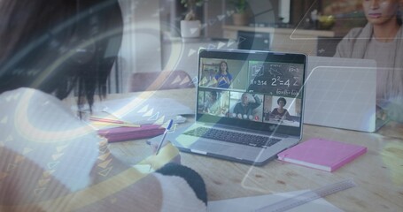Writing left teen white-sweater dark-cuffed, studying at wooden table with laptop and pink notebook © vectorfusionart
