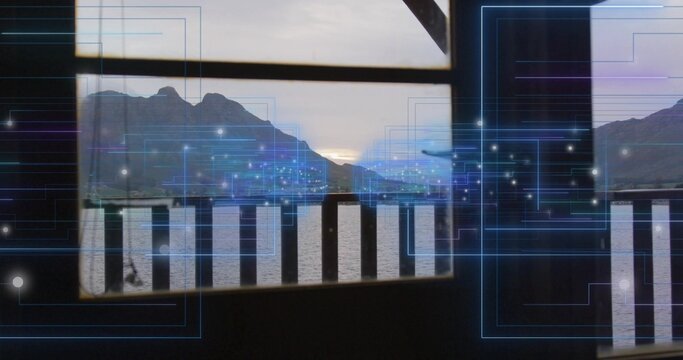 Framing framed lake and mountain view from covered deck, with wooden balustrade and blue overlay
