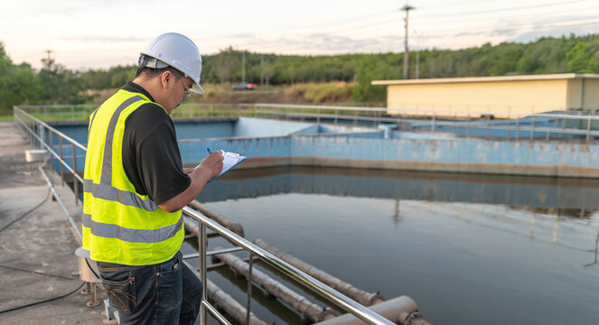 Environmental engineers work at wastewater treatment plants,Male plumber technician working at water supply