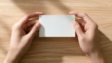 Obraz premium Minimalist business card placement on table top view blank card aesthetic professional environment creative concept