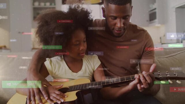 Father placing guitar on laps, guiding her fingers and strumming while social UI drifts for music