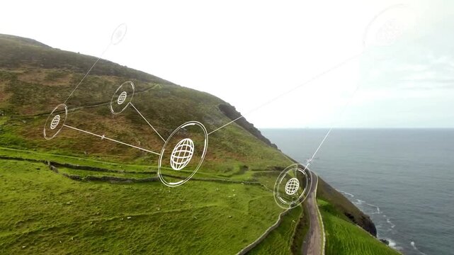 Animated network overlay appearing and linking nodes across coastal hillside, drone approaching sea