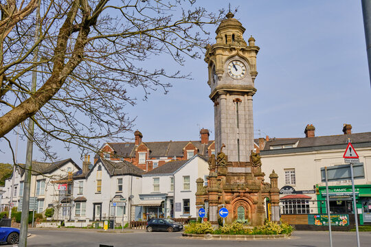 Exeter, United Kingdom  - March 22 2026. Hele's Clock Tower, Exeter's Victorian memorial to Queen Victoria, rises above surrounding shops and houses on the Heavitree roundabout on a clear spring day.