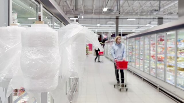Choosing food from shelf at the supermarket,vegetables in the grocery section, Grocery stores 