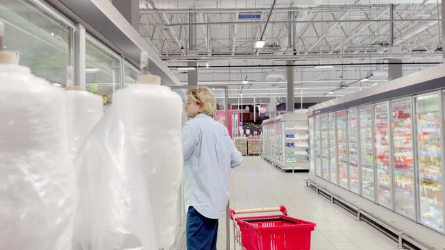 Choosing food from shelf at the supermarket,vegetables in the grocery section, Grocery stores 