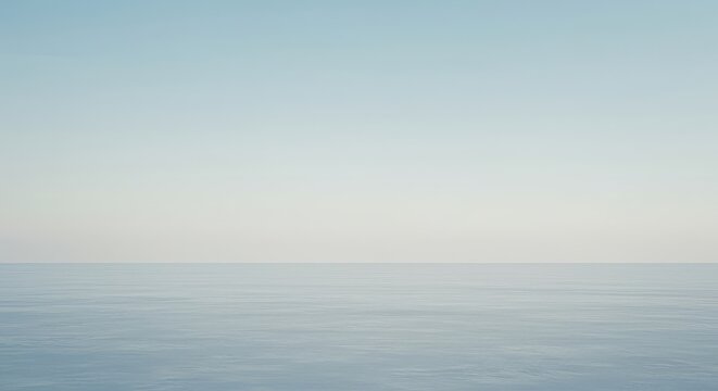 Endless horizon line separating a vast, pale blue sky from a uniform empty ground plane. Clean, minimalist composition representing potential and future, conceptual, empty, clean