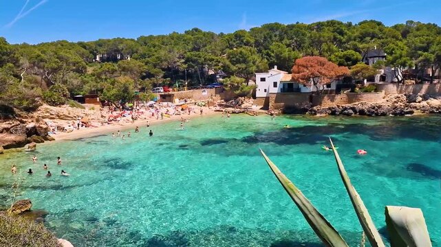 Spain Mallorca Cala Gat beach turquoise water 4K, white villas on cliffside, Mediterranean lifestyle summer vacation scenery, Cala Ratjada Balearic islands
