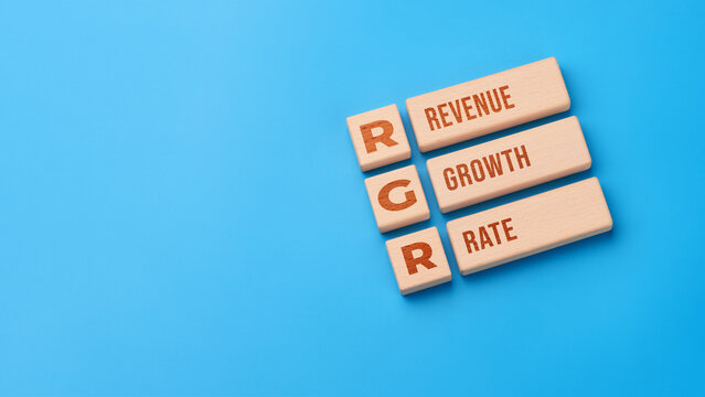 Revenue growth rate concept with wooden blocks and RGR abbreviation
