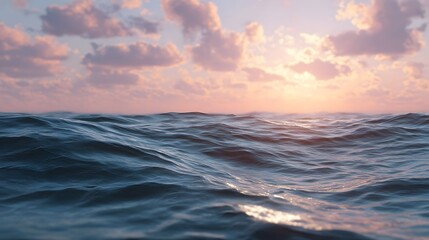 Obraz premium Vast seascape view at dawn or dusk featuring calm waves reflecting the warm glow of the colorful sky