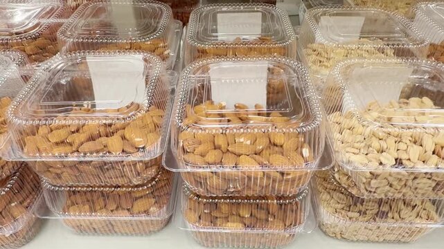 Choosing a variety of nuts at the supermarket