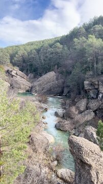 Mountain river flowing through rocky canyon in Guara, Spain