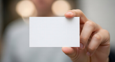 Obraz premium Person Holding Blank White Business Card for Mockup