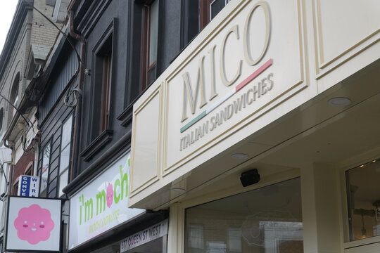 exterior building and sign of Mico Italian Sandwiches located at 679 Queen St W, Toronto