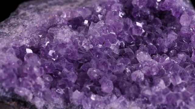 Close-up of a Magnificent Amethyst Geode - A Stunning Display of Crystal Formation. This striking image showcases a detailed close-up of a natural amethyst geode. The dense cluster of deep purple