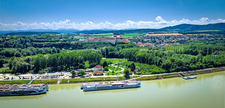 Melk abbey on Danube river in front of the foothills of the Alps on the horizon in the Wachau region in Upper Austria, Austria