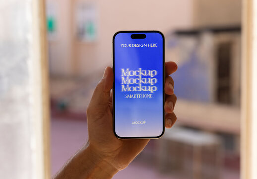 Mockup of a Smartphone Held in Hand