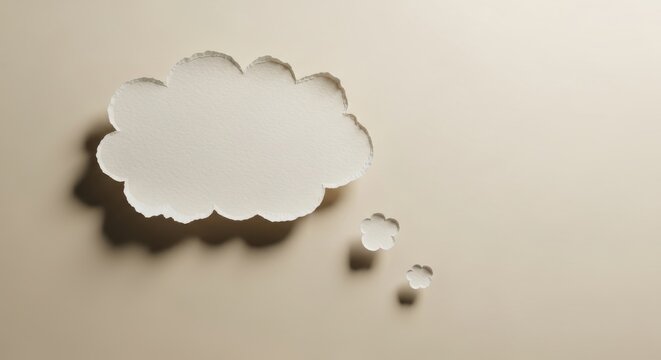 Thought bubble torn from paper on neutral background representing communication idea brainstorming and social media speech cloud concepts 