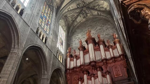 Soaring Gothic Nave and Pillars of the Narbonne Cathedral Interior