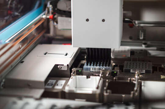 Closeup Industrial Pickandplace Machine Assembling Printed Circuit Board Components Under Automated Camera