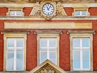 Vintage building facade. Historical brick building emphasizing civic pride and textured masonry features © Vladimir