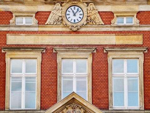 Vintage building facade. Historical brick building emphasizing civic pride and textured masonry features