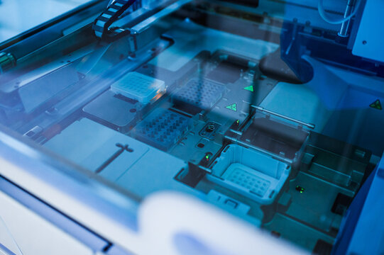 Closeup Inspection Bed With Component Trays And Sensor Readouts Under Cool Lighting, Detailed View Of Test