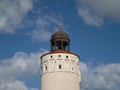 Historic tower scene. Picturesque view of classic tower with dome amidst dramatic cloud formations