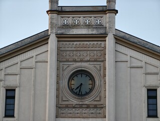 Elegant circular timepiece design. Symmetrical structure showcasing traditional architectural elements © Vladimir
