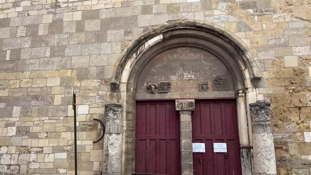 Rustic Wooden Door and Stone Arch Inside Narbonne Cathedral